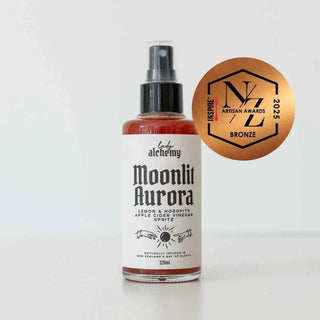 Bottle of 'Moonlit Aurora' with a bronze award badge on a white background